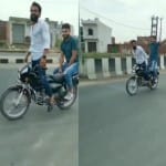 बाइक से स्टंट करते युवक।