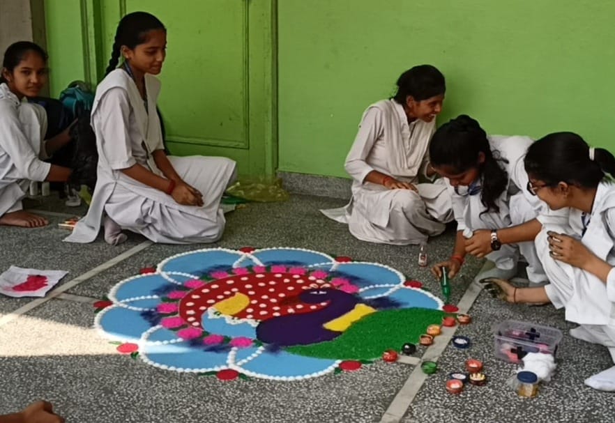 Adorable Rangoli made by girl students