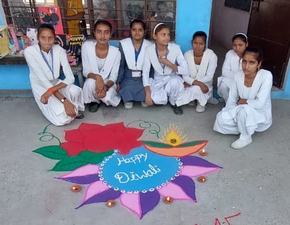 Students made attractive Rangoli with lamp decoration
