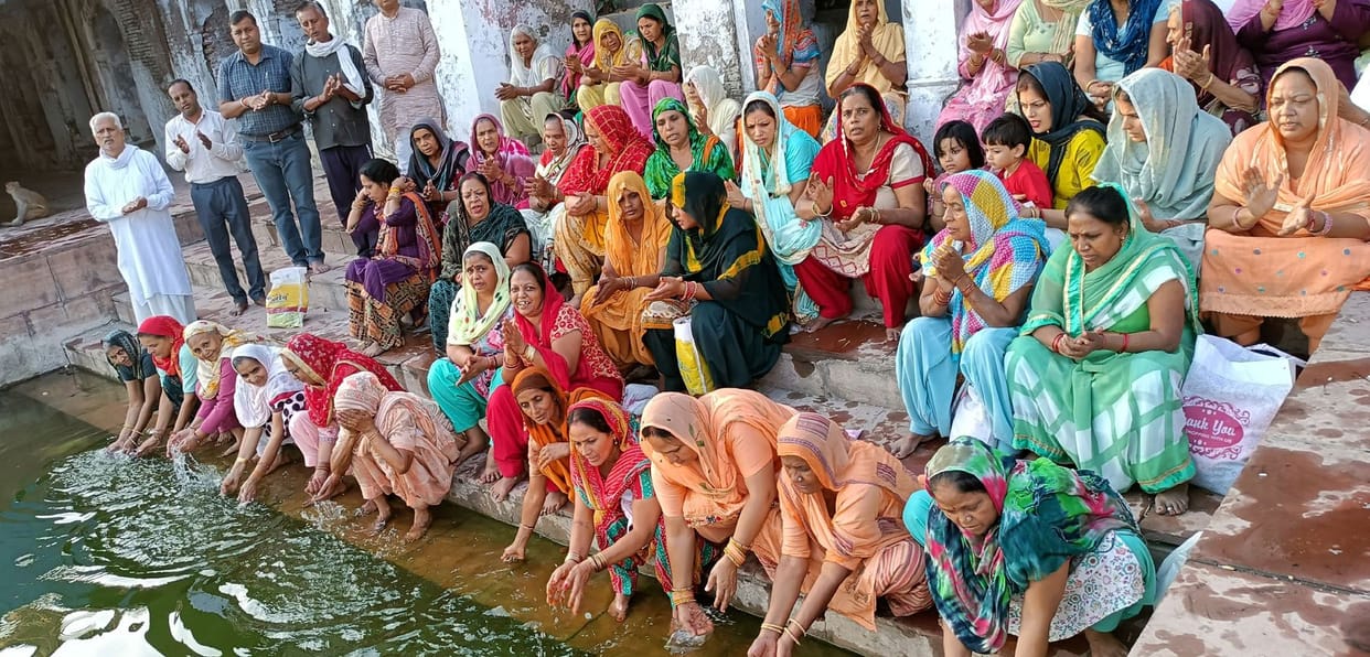 Taking a dip at Shri Kapil Sarovar