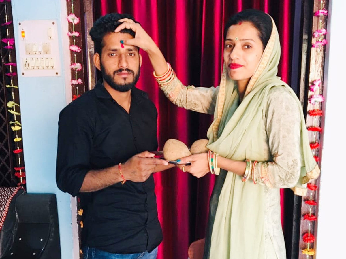 Sisters wish their brothers long life by doing Mangal Tilak