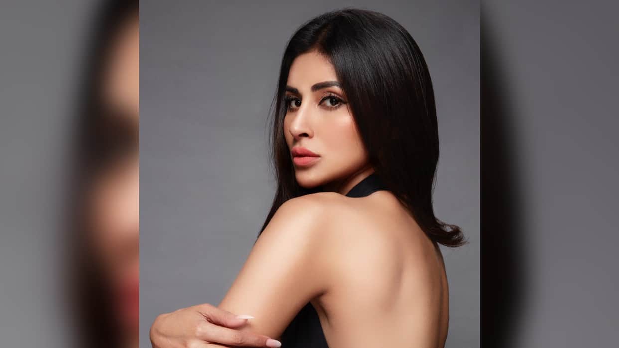 mouni roy adjust her extremely tight dress in front of camera wearing pink floral dress