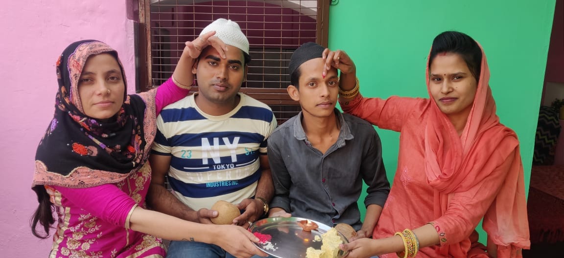 Sisters wish long life by tilak on brother