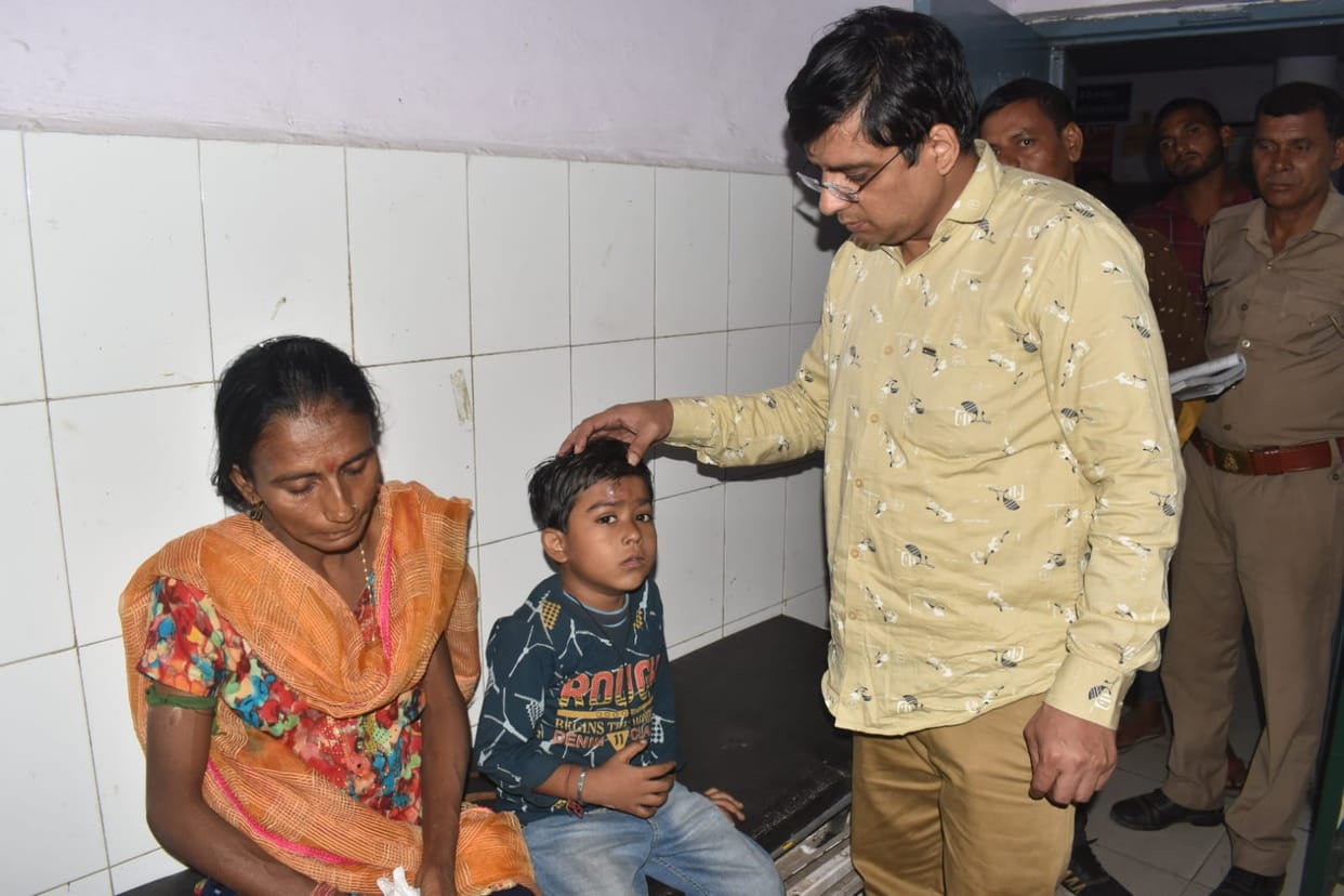 The son was saved by throwing his son from the moving bus amidst the smoke.