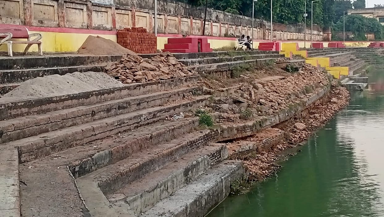 Standing on the dilapidated stairs, fasting women will perform Chhath Puja