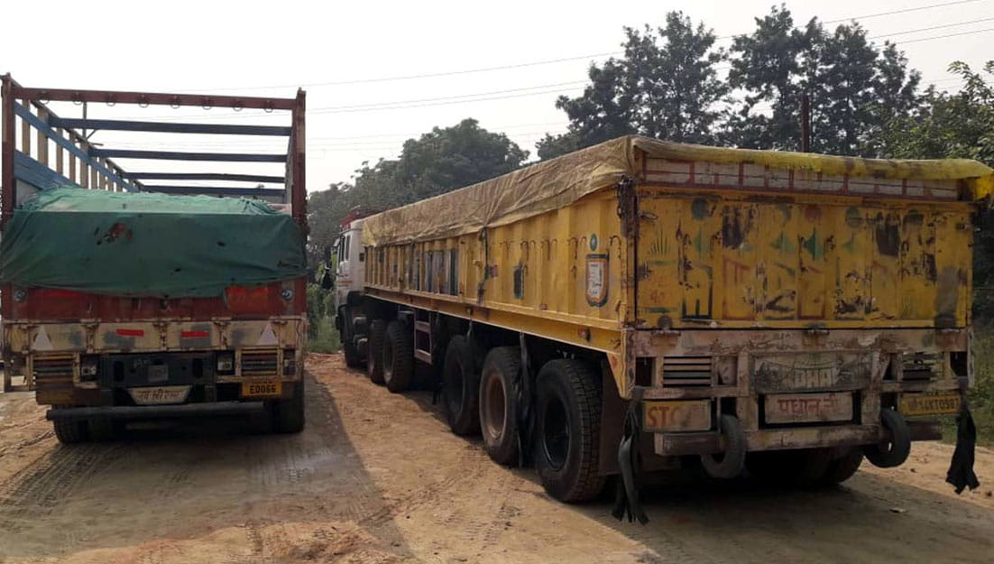 Caught two overloaded trucks loaded with dust, fined