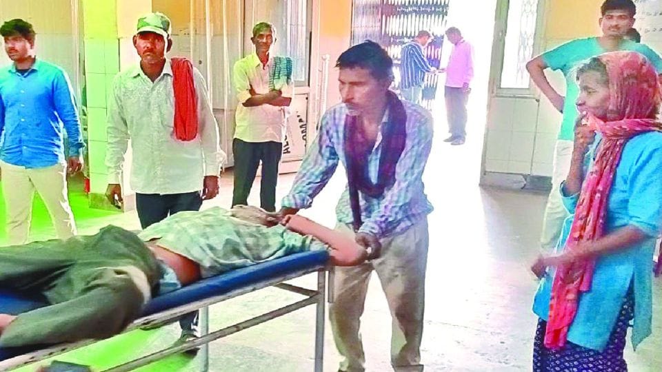 patients relatives pulling stretchers in district hospital mainpuri