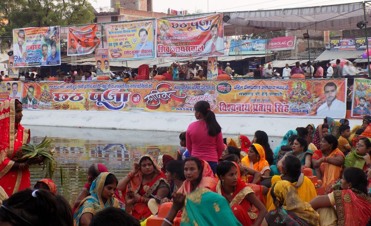 Chhath Ghat filled with banners and posters of potential candidates, competition for service