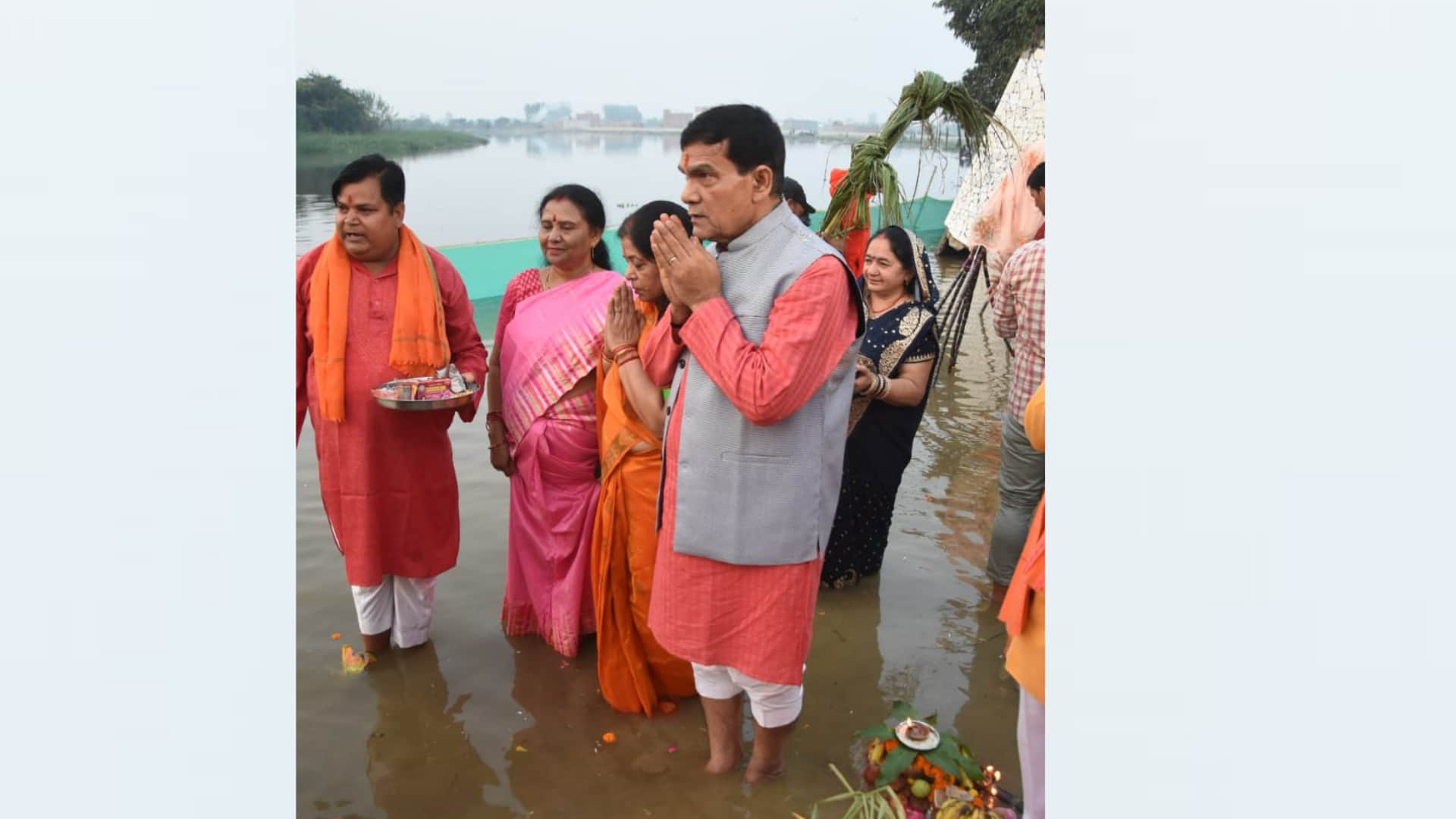 Women offer prayer on Chhath Puja on banks of river Gomati in Lucknow.