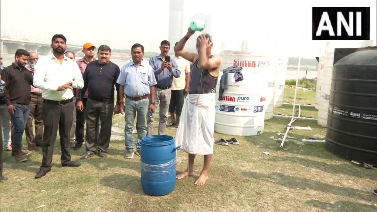 Director of Delhi Jal Board takes a dip in Yamuna after BJP MP s challenge