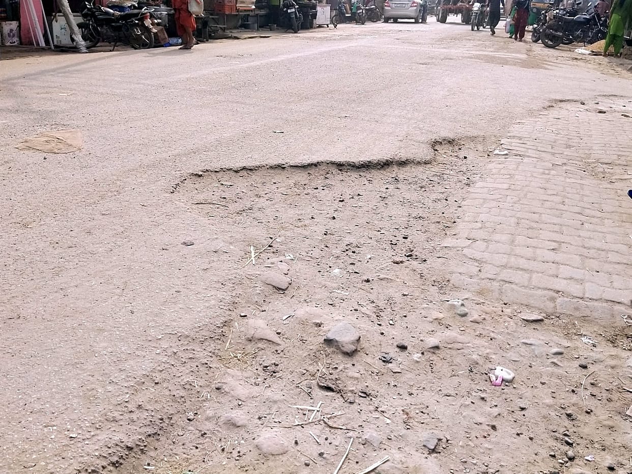 The dust blowing from the broken road is breathing