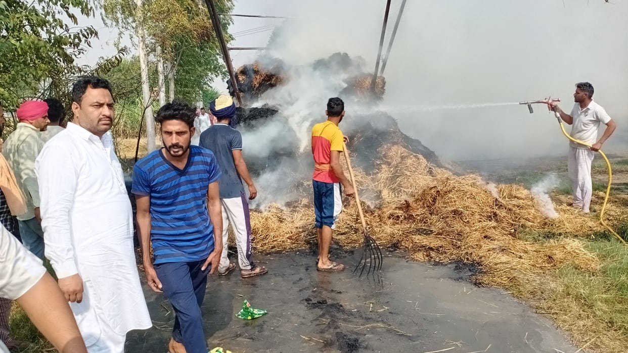 Trolley filled with stubble bales catches fire due to short circuit