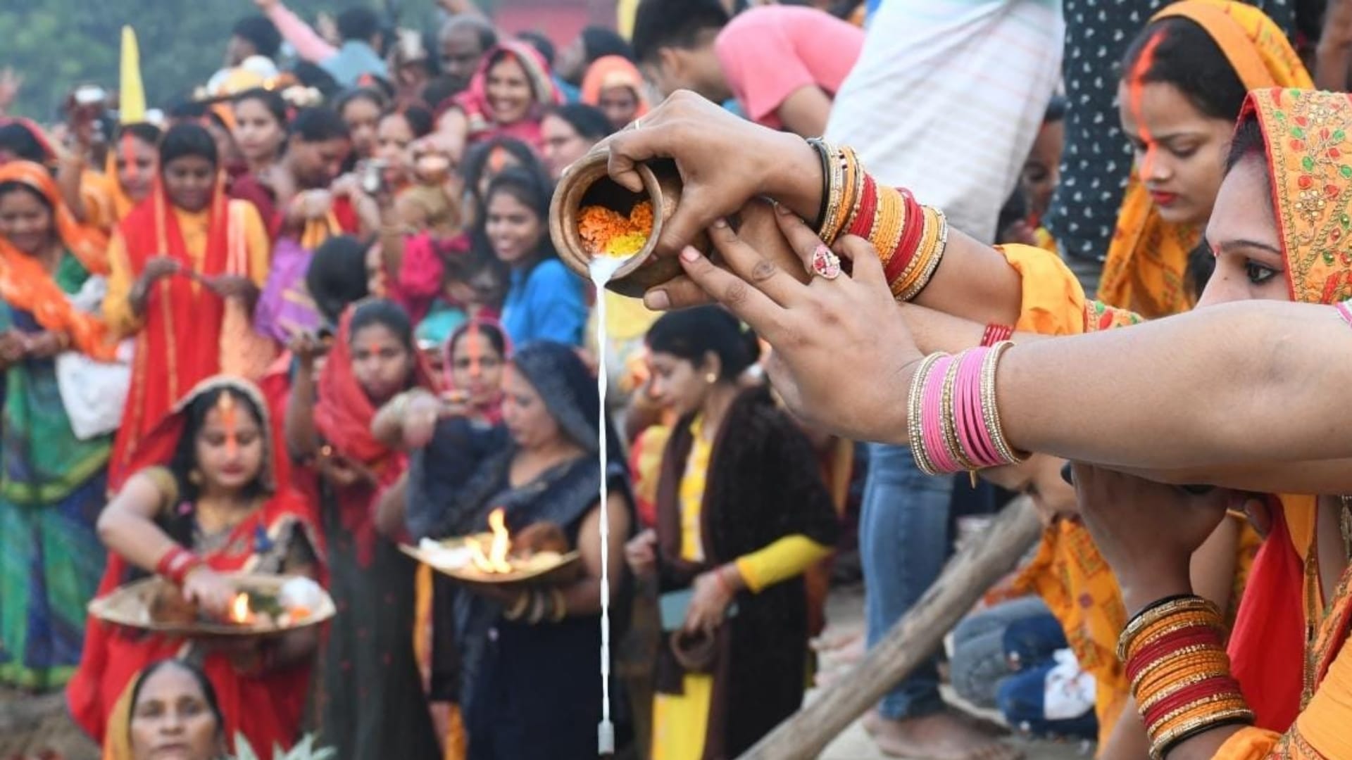 Women complete their fast of Chhath Puja on Monday morning.