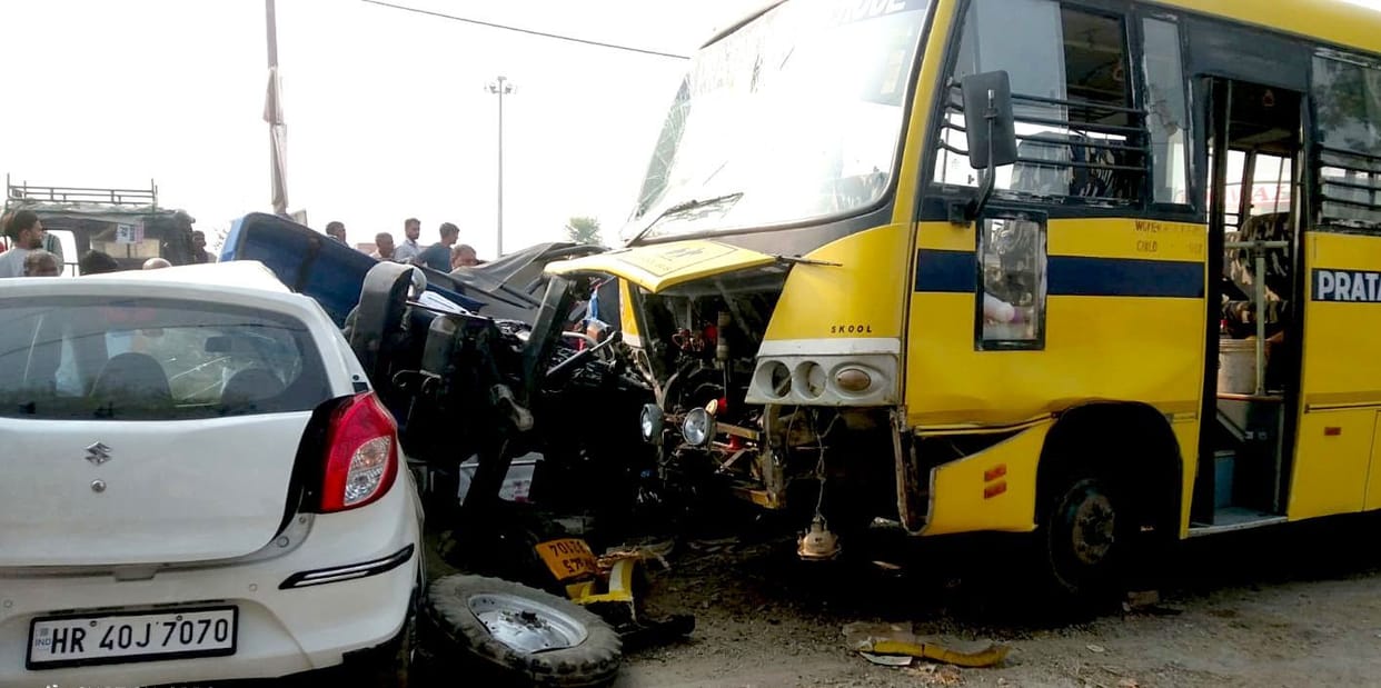 Tractor overturned on car due to collision with school bus, driver serious