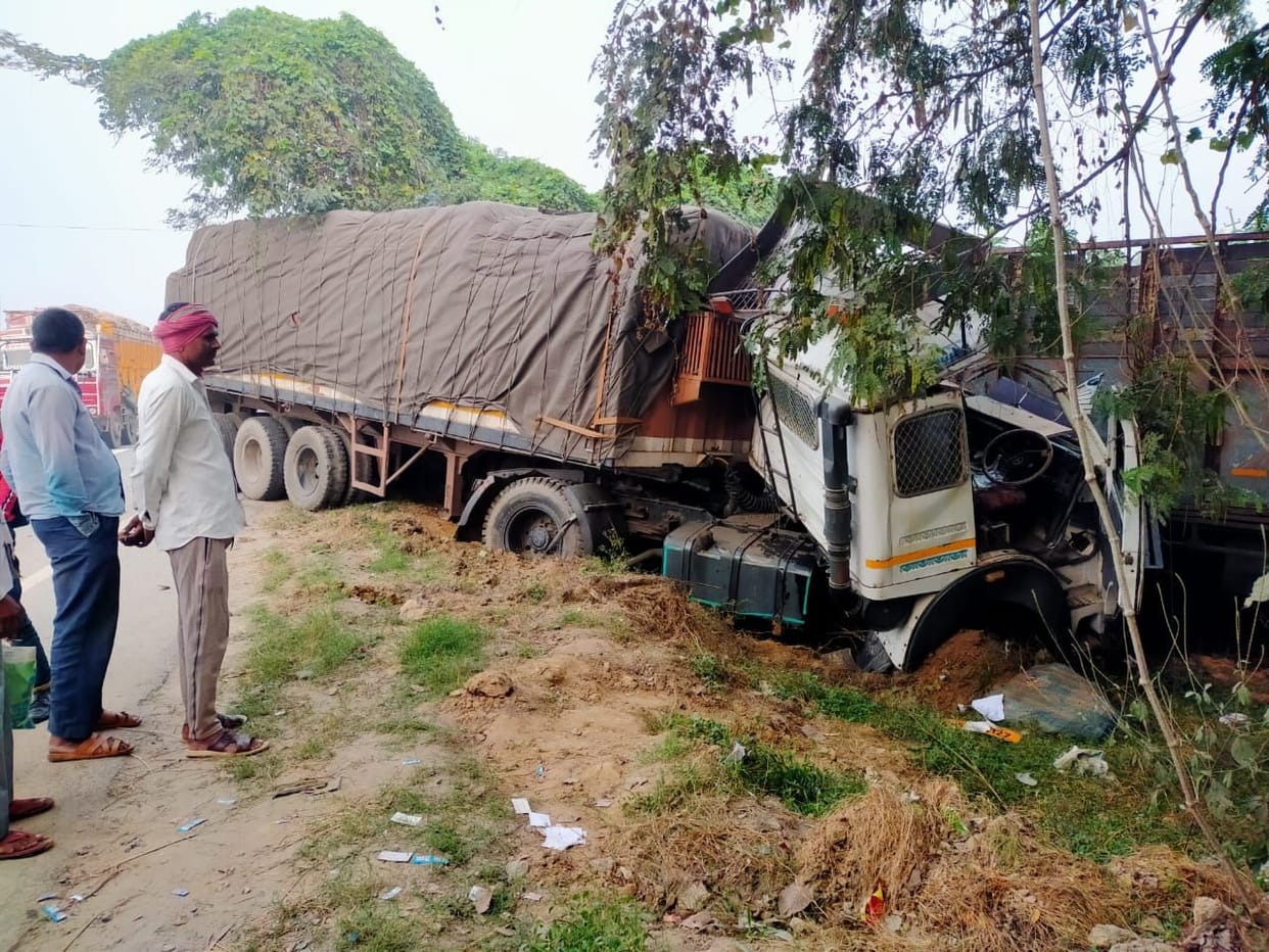 Truck driver dies after being hit by trailer