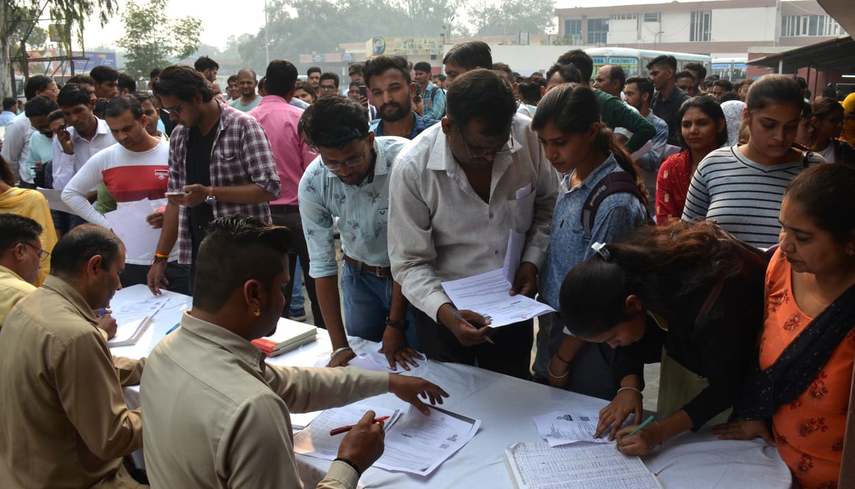 Crowd gathered for booking the bus, police personnel deployed