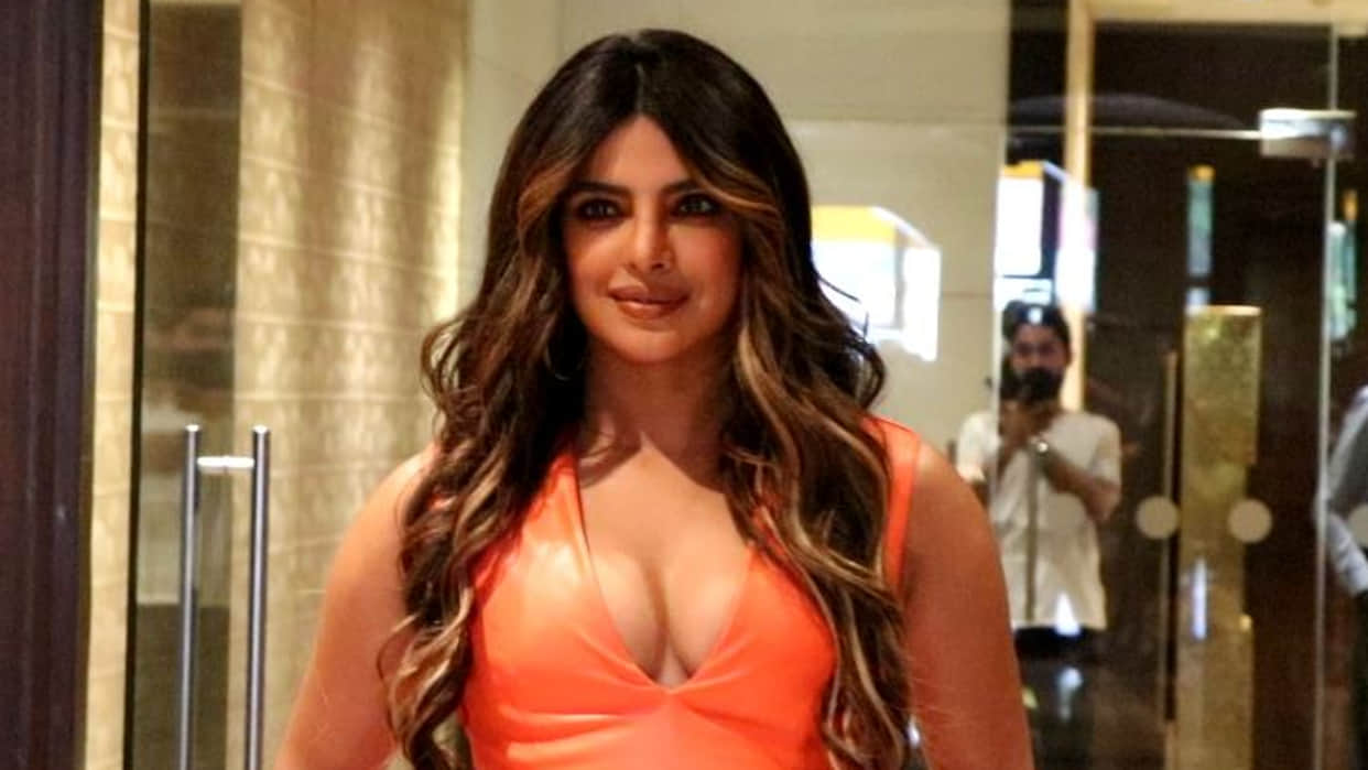 Desi Girl Priyanka Chopra nailed her recent look in orange body hugging dress, photos goes viral on internet