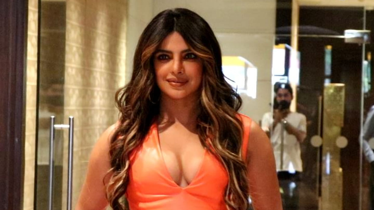 Desi Girl Priyanka Chopra nailed her recent look in orange body hugging dress, photos goes viral on internet