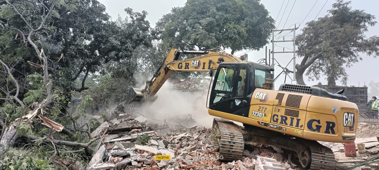 Bank, petrol pump, temple coming in the middle of the highway removed