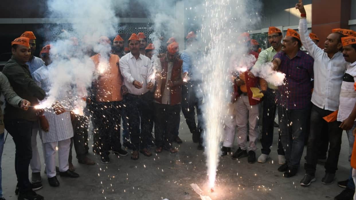 BJP activists celebrate win in bypoll election.