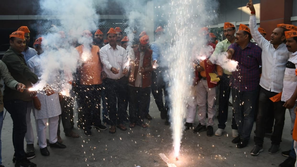 BJP activists celebrate win in bypoll election.