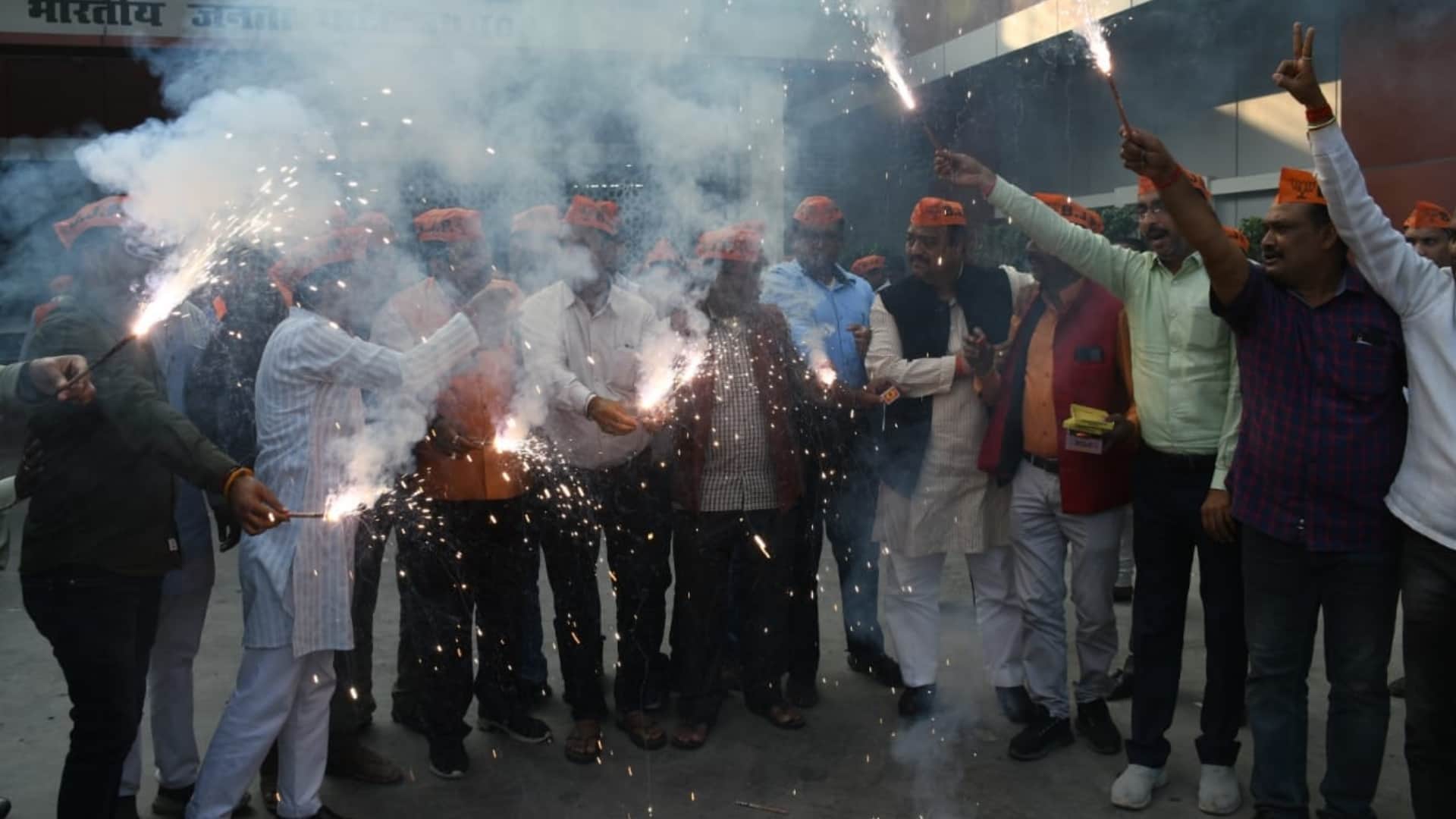 BJP activists celebrate win in bypoll election.