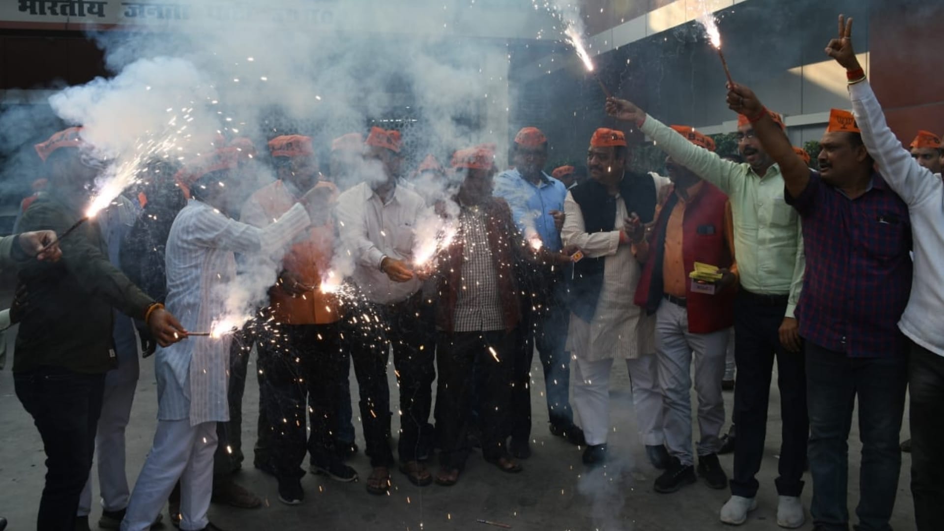 BJP activists celebrate win in bypoll election.