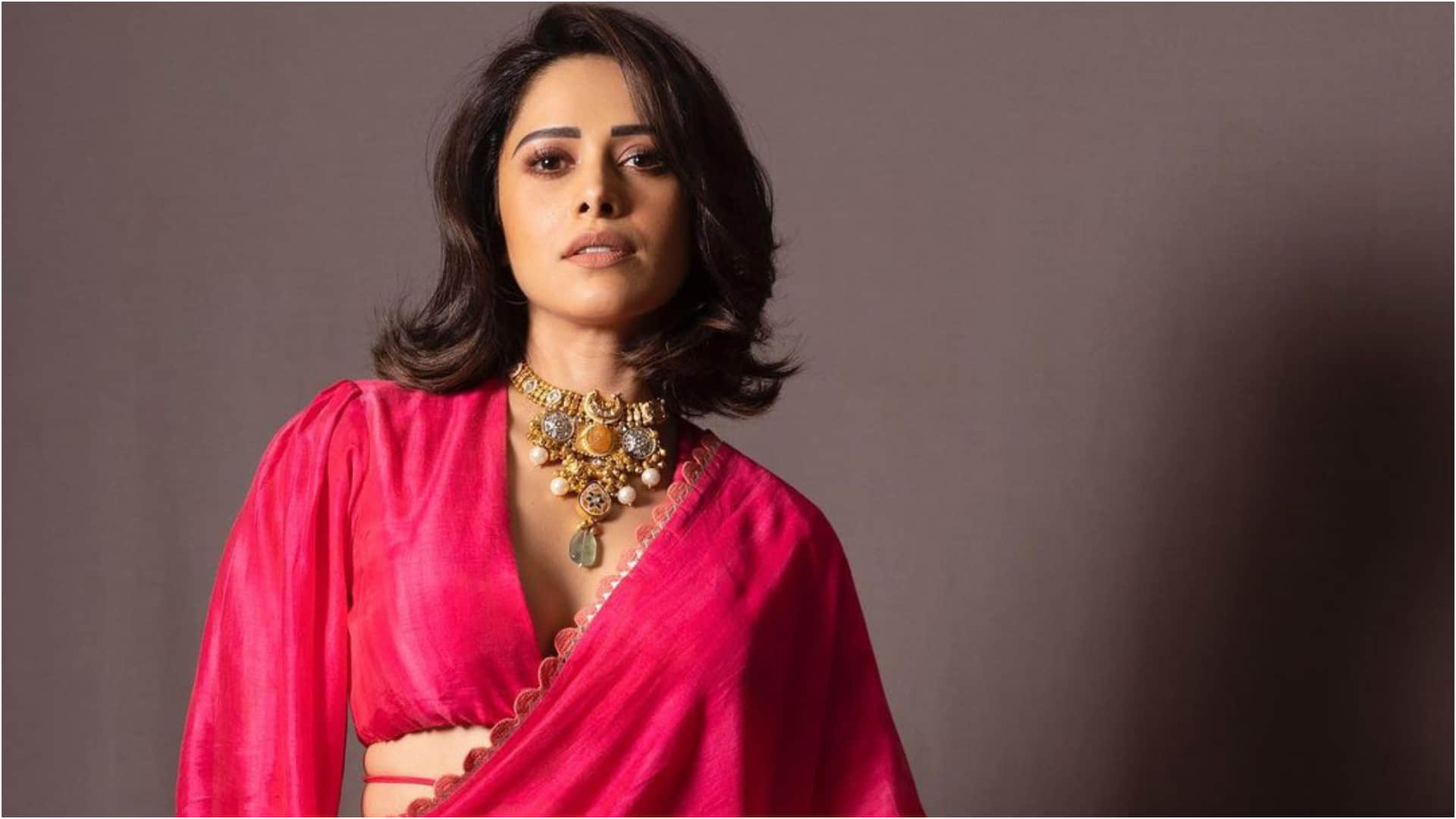 nushrat bharucha looks oh so gorgeous in fuchsia pink saree with bold design neckline blouse