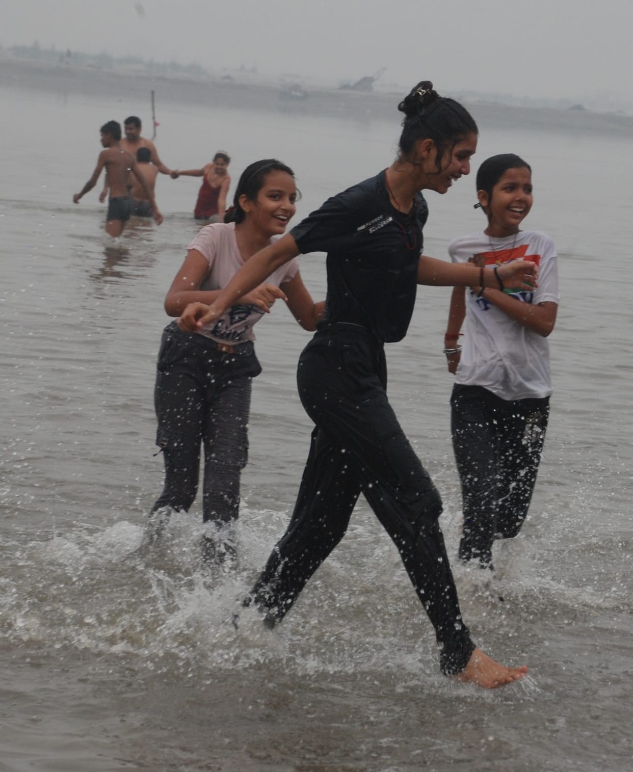 Devotees offer prayers by taking a dip in Yamuna