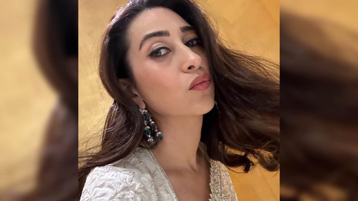 karisma kapoor perfect wedding guest in ivory saree from manish malhotra in monaco
