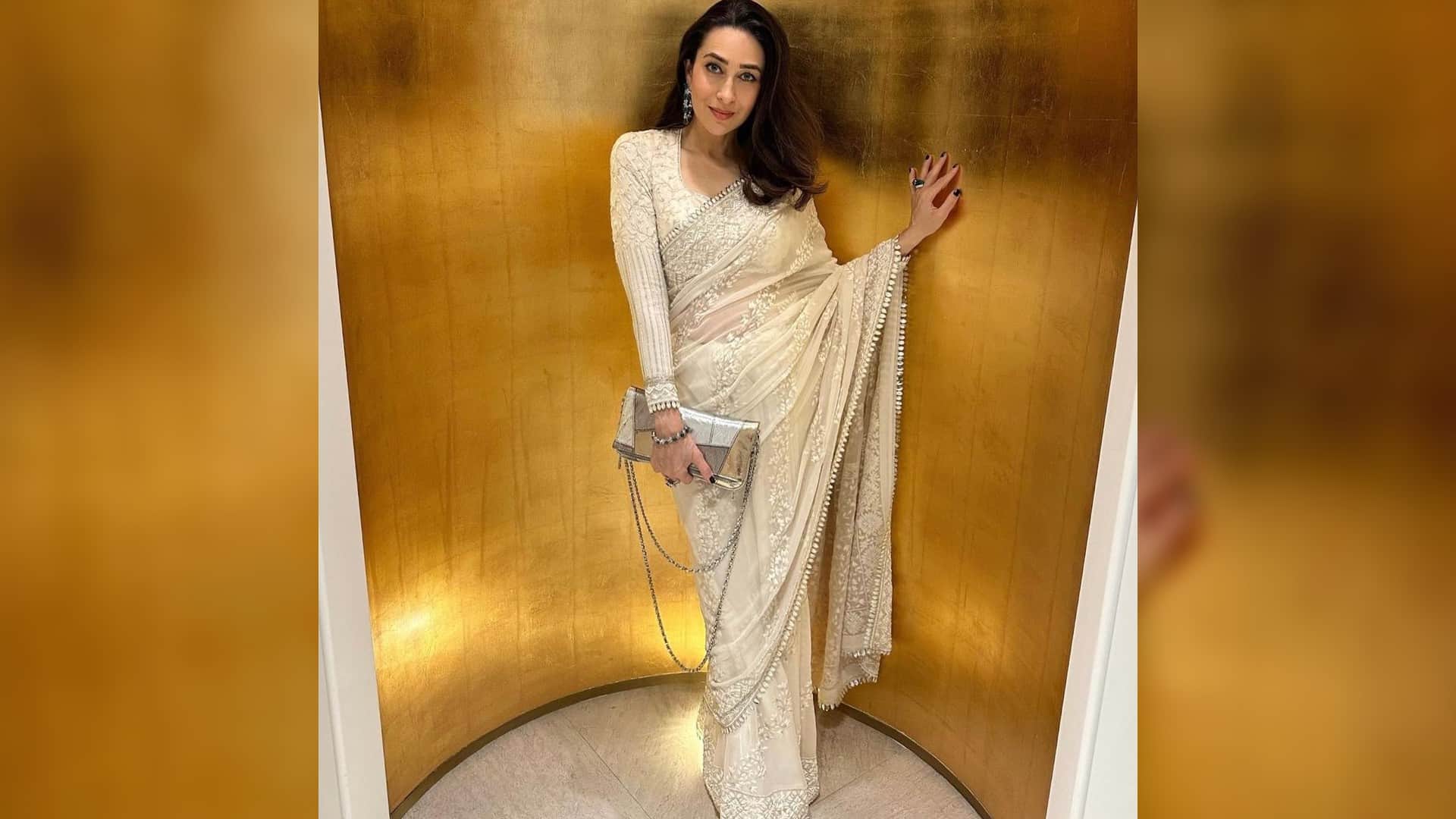 karisma kapoor perfect wedding guest in ivory saree from manish malhotra in monaco
