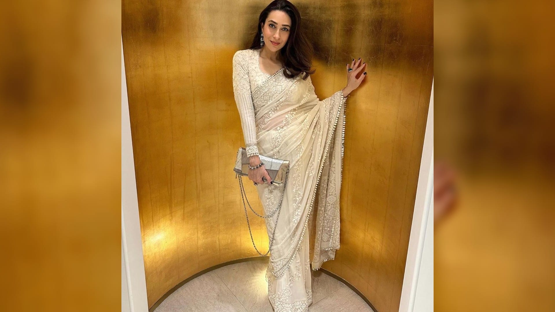 karisma kapoor perfect wedding guest in ivory saree from manish malhotra in monaco