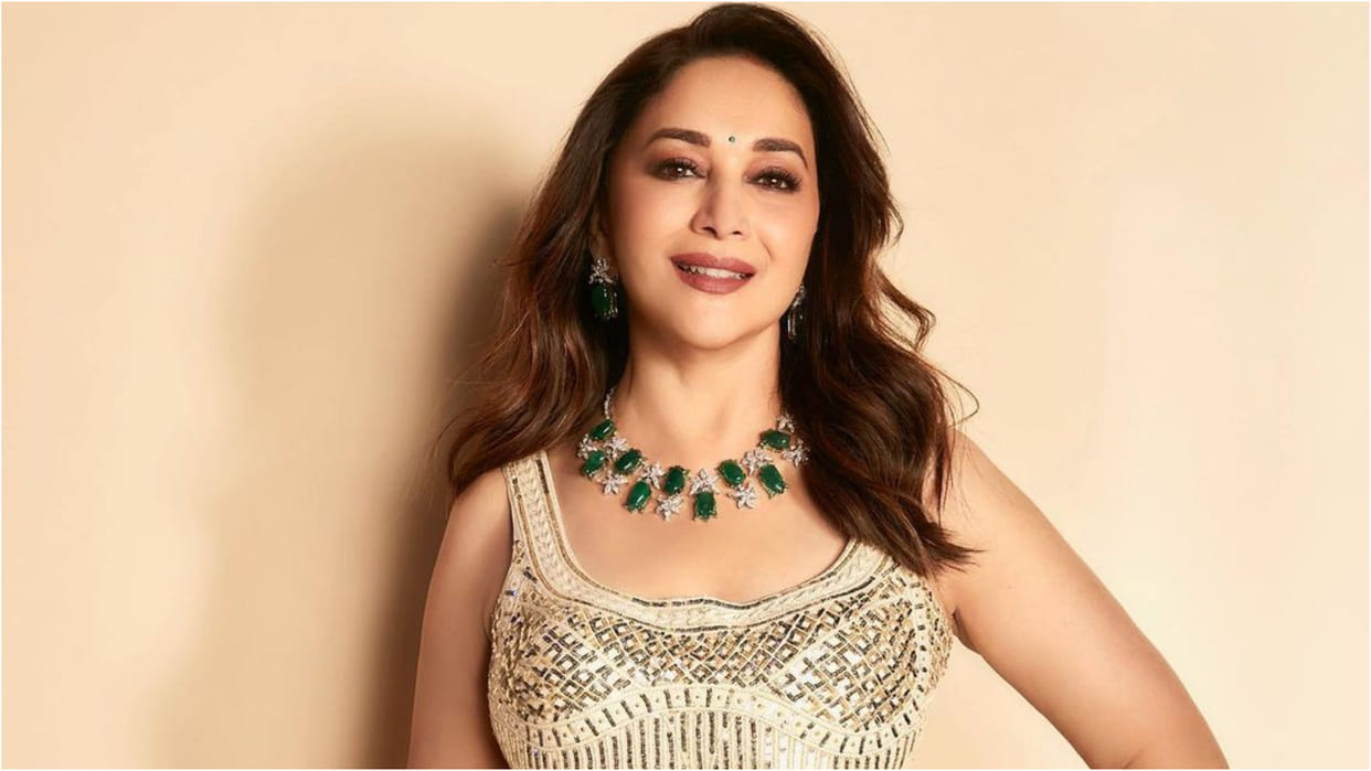 madhuri dixit looks charming in ivory lehenga set with emerald necklace