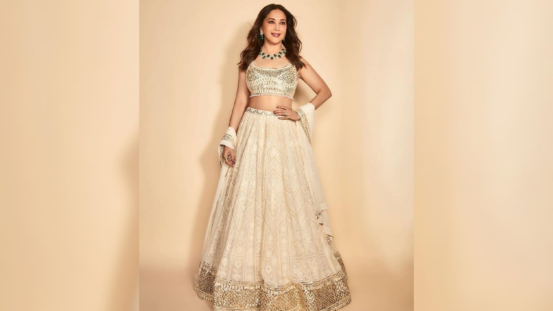 madhuri dixit looks charming in ivory lehenga set with emerald necklace