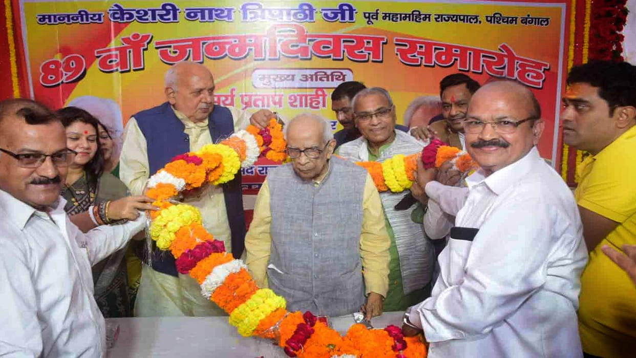 Surya Pratap Shahi hugged after touching the feet of former governor Keshari Nath