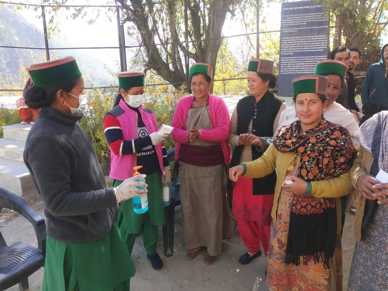 hand senitization in kinnaur booth before voting