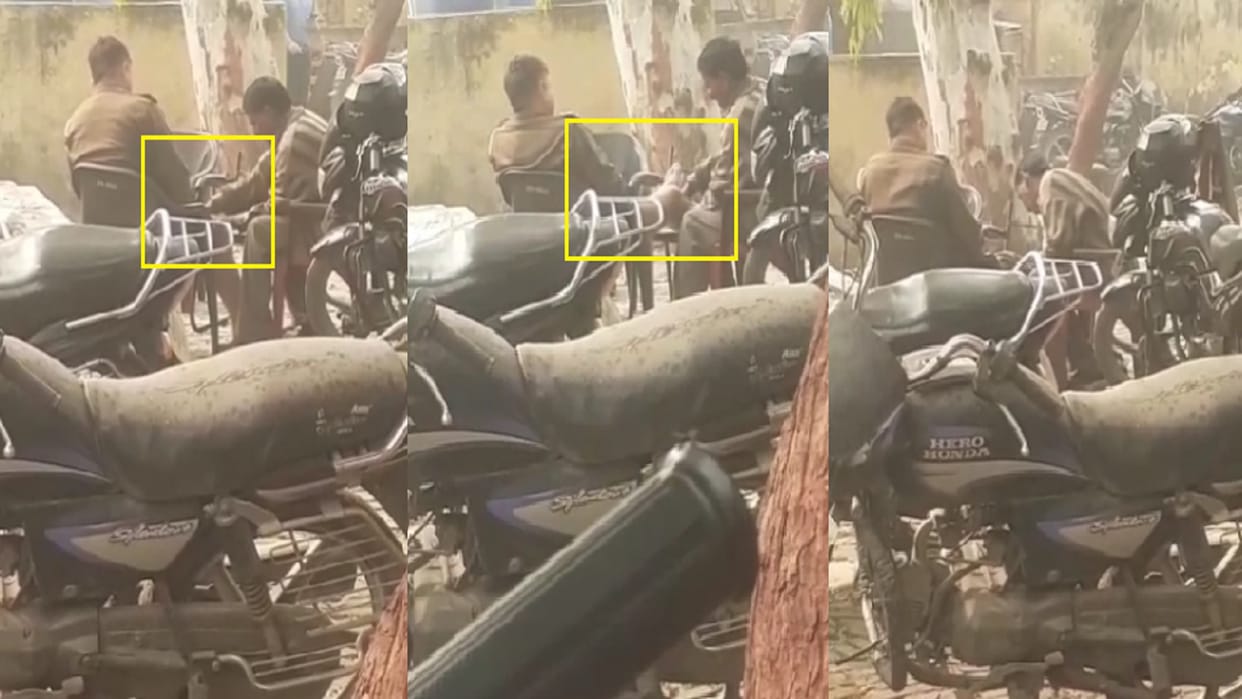 A sub-inspector getting massage by sweeper in police station in Shamli video viral