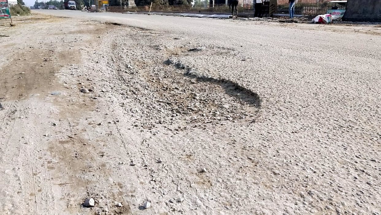 People of the district forced to travel on broken roads