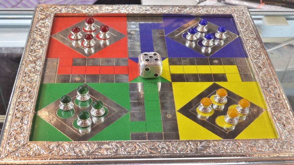 Silver shoe and car and gold jewellery in Jewellery Expo in Agra