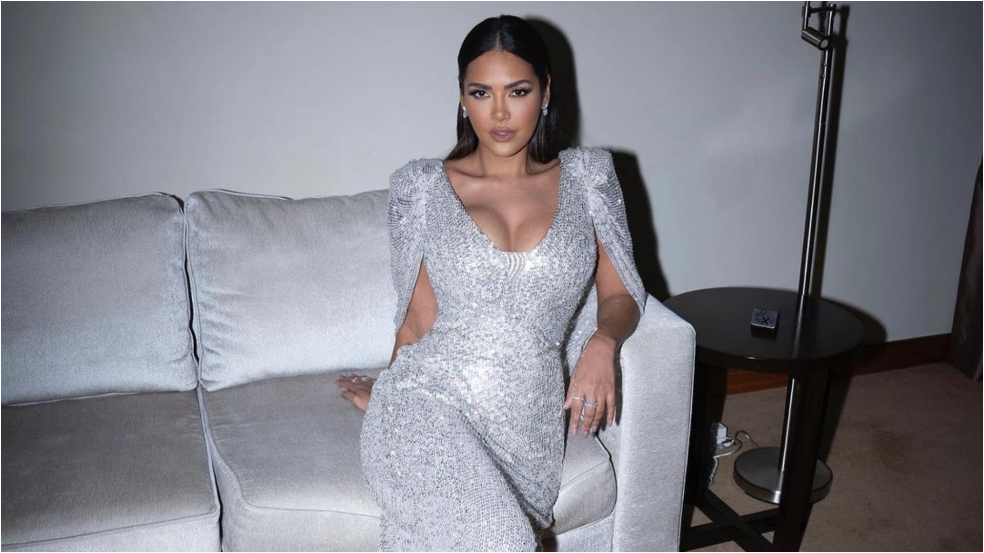 esha gupta gorgeously poses on couch in silver gown bold and hot photoshoot