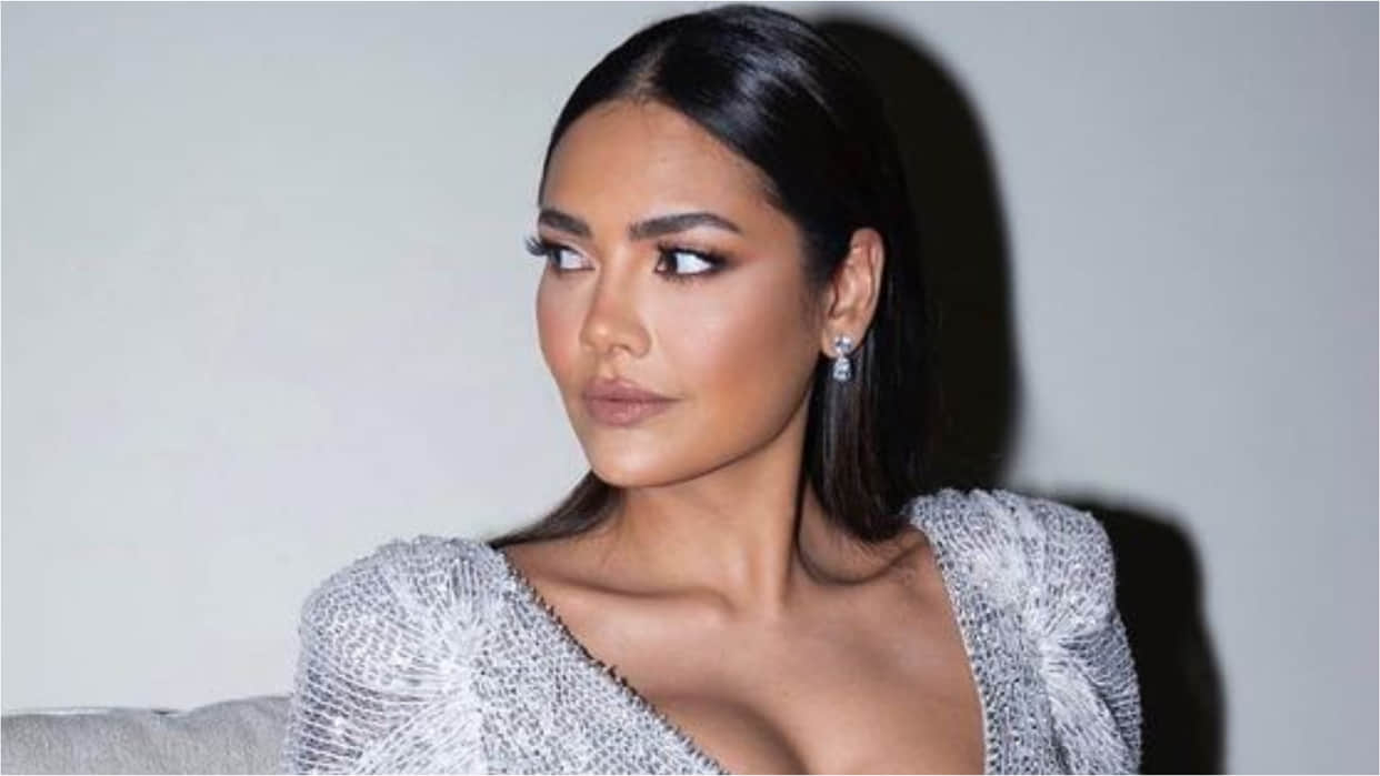 esha gupta gorgeously poses on couch in silver gown bold and hot photoshoot