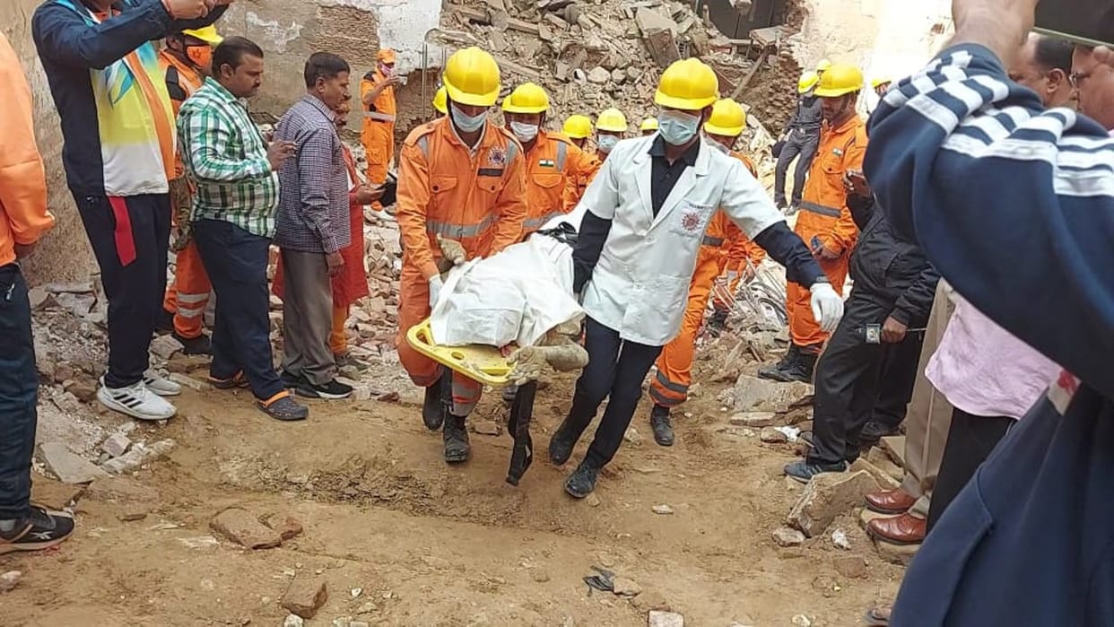 After fourteen hours of effort, the dead body was removed from the debris