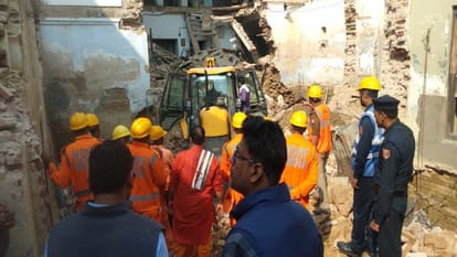 After fourteen hours of effort, the dead body was removed from the debris