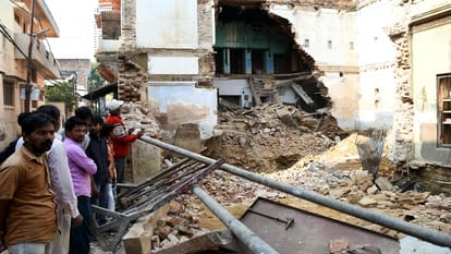 After fourteen hours of effort, the dead body was removed from the debris
