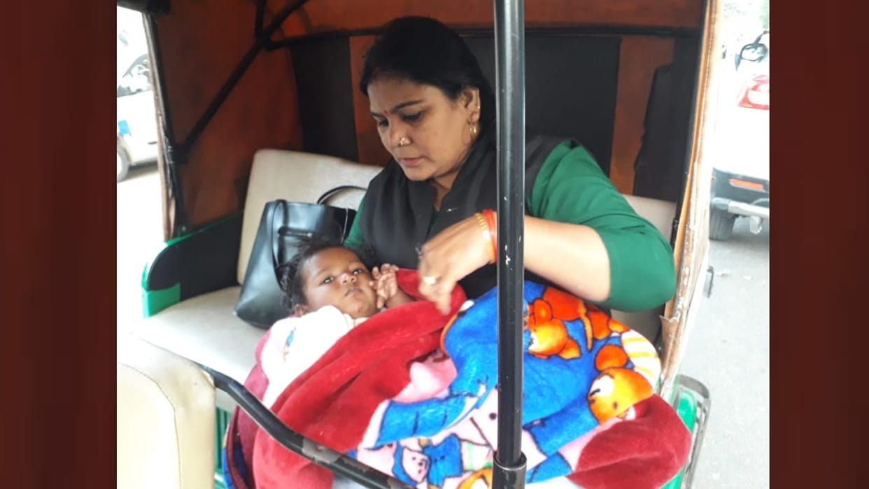 some body throws a child on the road in Lucknow.
