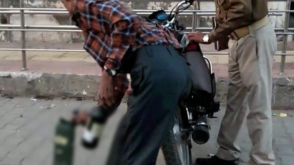 Monkeys took out liquor bottle from policeman bike outside SP office in Agra