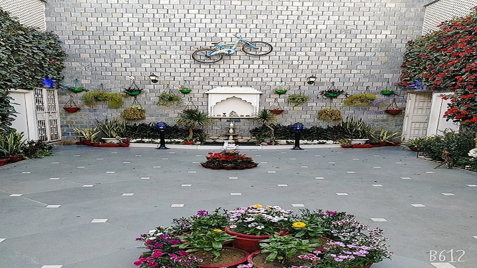 hobby of flowering and greenery was such that the house itself was converted into a green house