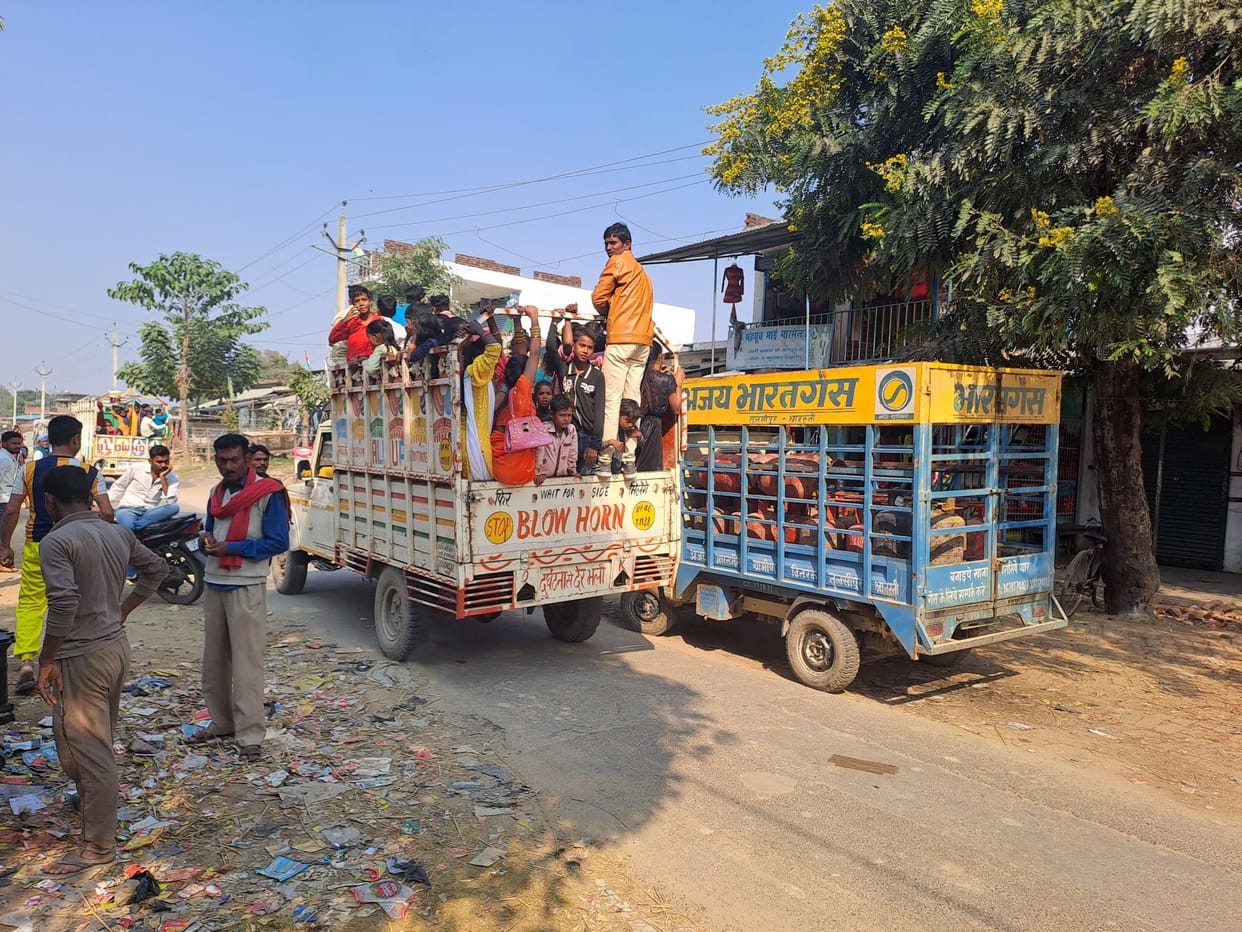 Passengers being fearlessly carried in tractor-trolley