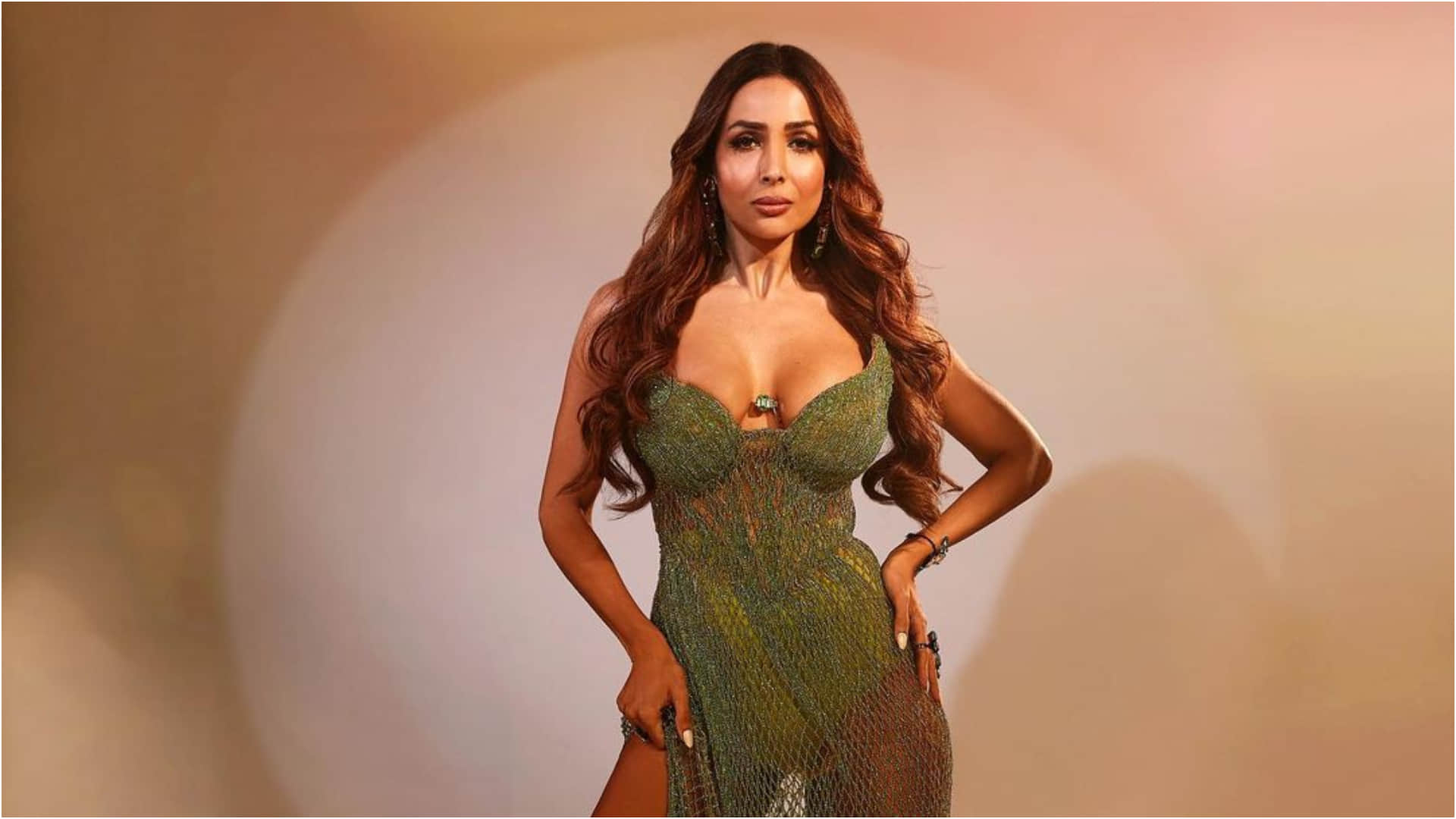 malaika arora show figure in jalidar high slit green gown in new look