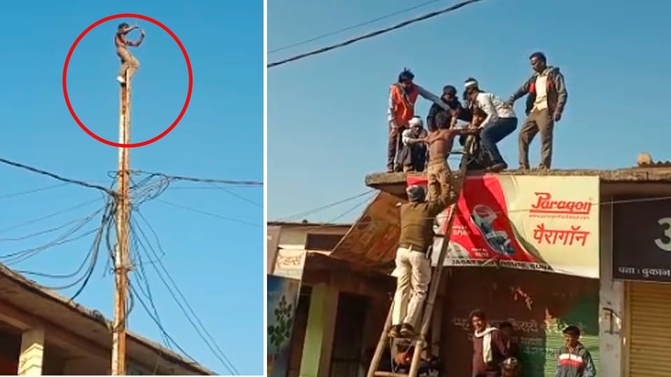 Drunken youth climbed on the pole demanding liquor, police persuaded by giving quarter